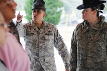 Tech. Sgt. Raul Lopez, 96th Logistics Readiness Squadron, corrects a new Air Force Reserve recruit Feb. 6 at Duke Field.  Sergeant Lopez and his wife, Master. Sgt. Tiffany Lopez (pictured), 96th Force Support Squadron, both former active-duty military training instructors at Lackland AFB, Texas, volunteered their time to help new reserve recruits prepare for basic training during the drill weekend here.  The husband and wife team spent four years instructing new trainees at Lackland graduating 25 flights from Basic Military Training.  (U.S. Air Force photo/Tech. Sgt. Samuel King Jr.) 