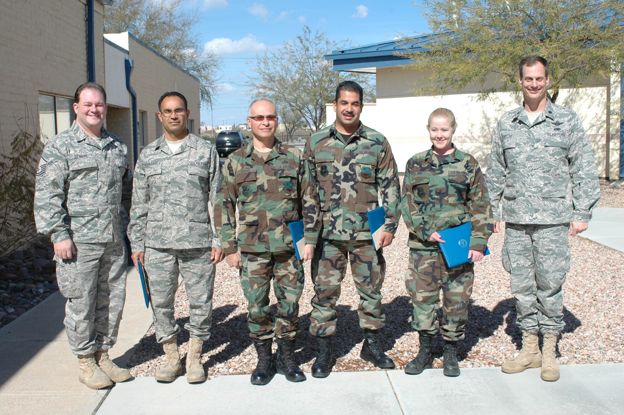 L-R:  Master Sgt. Jeffrey DeBuhr, Tech. Sgt. Fredrick Hernandez, Master Sgt. Fernando Cuevas, Staff Sgt. Saul Dojaquez, and Staff Sgt. Lena King were recognized by Lt. Col. James Taylor, (far right) as the 162nd Maintenance Group Top Performers for this quarter.  The ceremony took place Feb. 4.
(Air Force photo by Maj. Gabe Johnson)