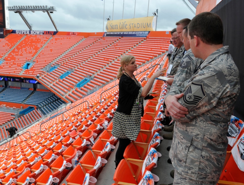 Superbowl coordinator Lisa Geers (left) speaks with members of the 125th Fighter Wing to ensure a successful flyover of four F-15 Eagles from the 125th Fighter Wing, Florida Air National Guard base in Jacksonville, Fla. for Superbowl XLIV, February 7, 2010. (USAF Photo by TSgt. Shelley Gill)Shelley Gill)