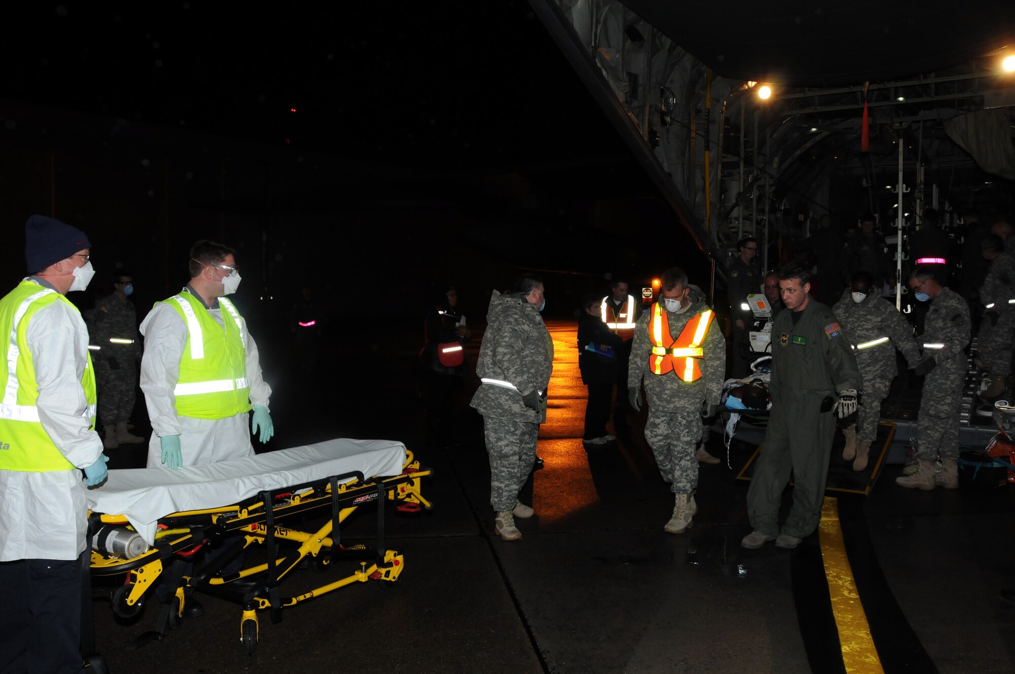 The C-130 from Haiti carrying medical evacuees was greeted by an entourage of medical personnel to take the patients onward to civilian hospitals for further treatment.  The 107th responded in support of Operation Unified Relief just four days after the 7.0 earth quake ravished Port-au-Prince, Haiti. (U.S. Air Force photo/Staff Sgt. Peter Dean) 
