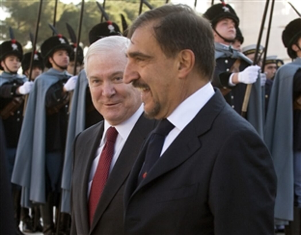 U.S. Defense Secretary Robert M. Gates and Italian Defense Minister Ignazio La Russa share a comment during a wreath-laying ceremony at the Vittorio Emanuale Monument in Rome, Feb. 7, 2010.