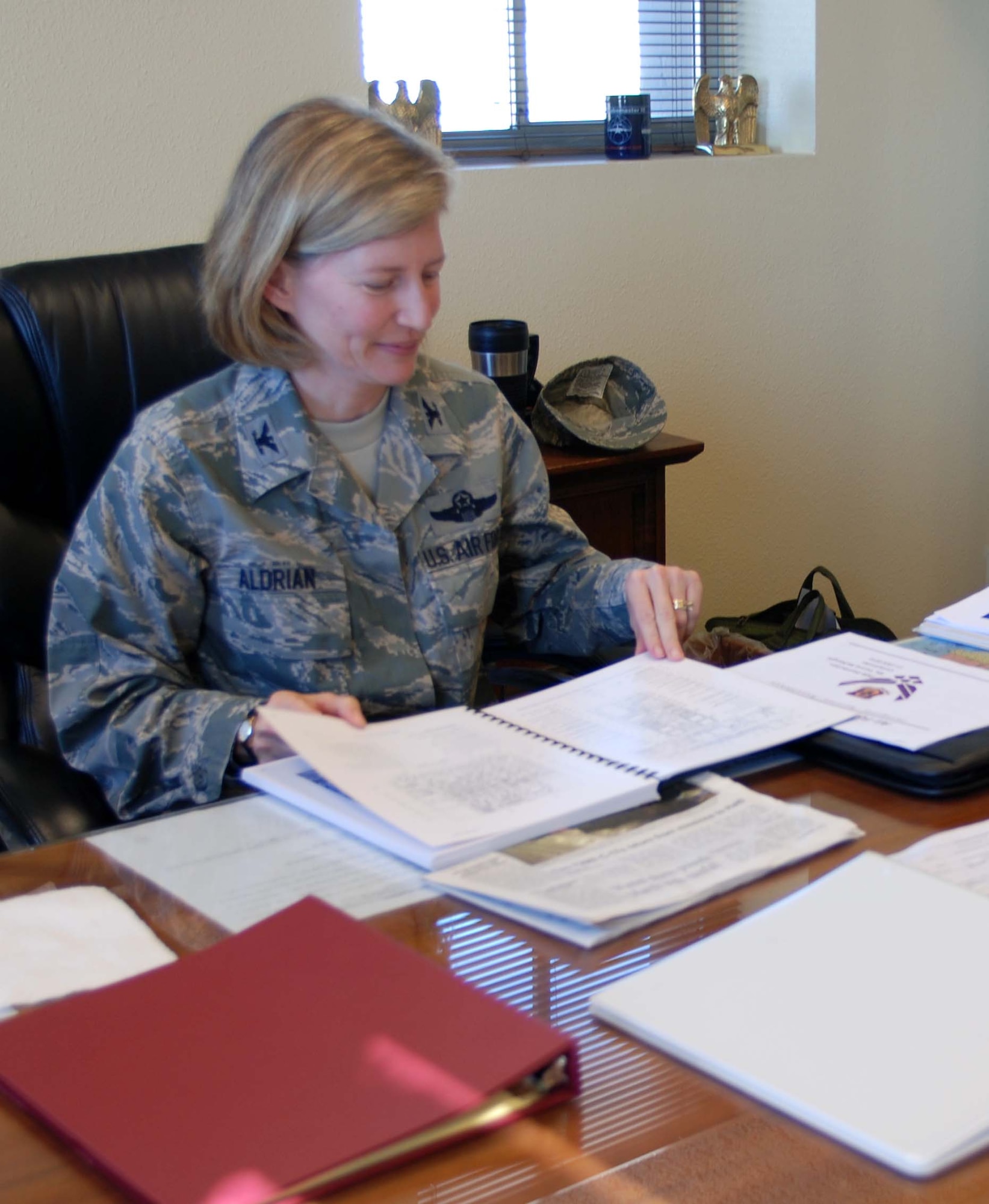 Col. Mary Aldrian, 452nd Air Mobility Wing vice commander, works at her desk in the wing headquarters building during the B UTA weekend, Jan. 24. (U.S. Air Force photo by Staff Sgt. Megan Crusher)