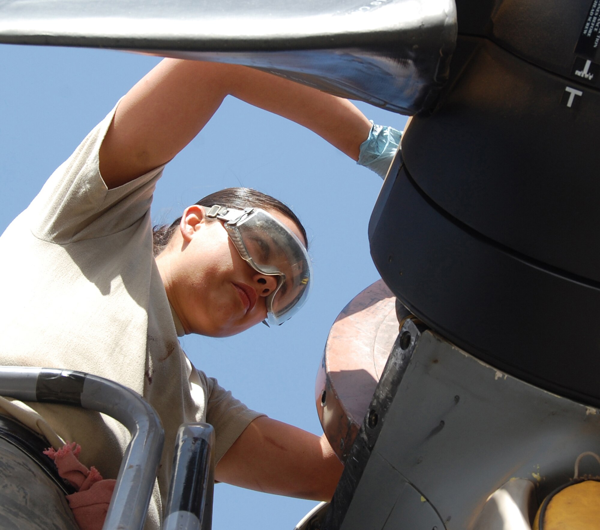 Senior Airman Rebecca Roa checks the propeller servicing on a C-130 Hercules Feb. 5, 2010, at an air base in Southwest Asia. Airman Roa is a crew chief assigned to the 386th Expeditionary Aircraft Maintenance Squadron. (U.S. Air Force photo/Staff Sgt. Lindsey Maurice)