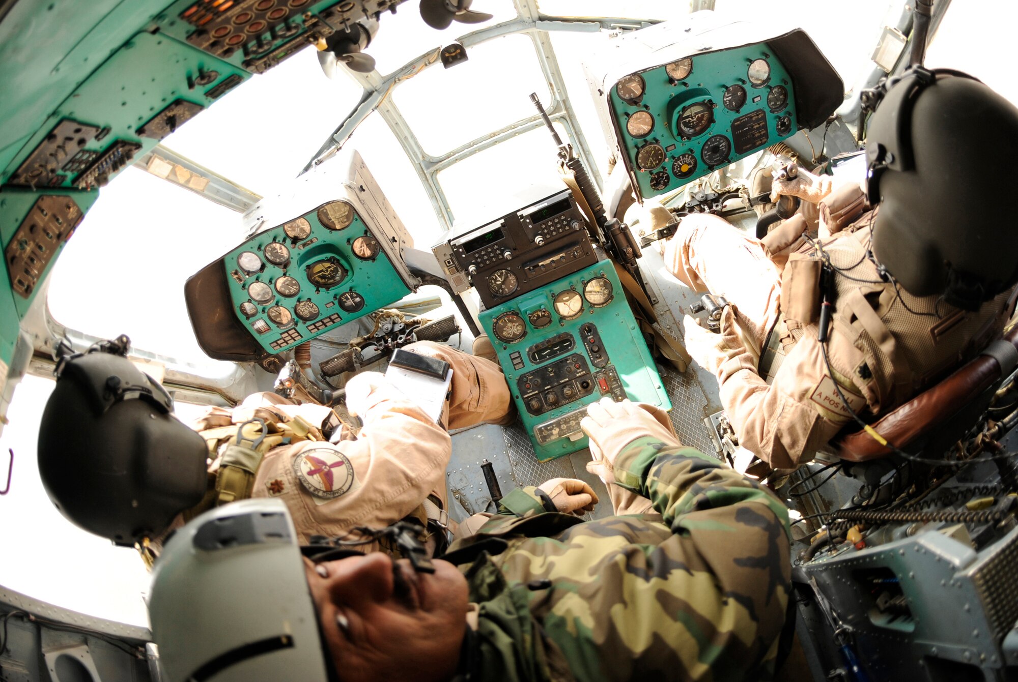 A joint U.S. Air Force and Afghan National Army crew from the 438th Air Expeditionary Advisory Group/Combined Air Power Transition Force pilots an Mi-17 helicopter during a medical evacuation mission Feb. 3, 2010, at Bagram Airfield, Afghanistan. (U.S. Air Force photo/Tech. Sgt. Jeromy K. Cross)