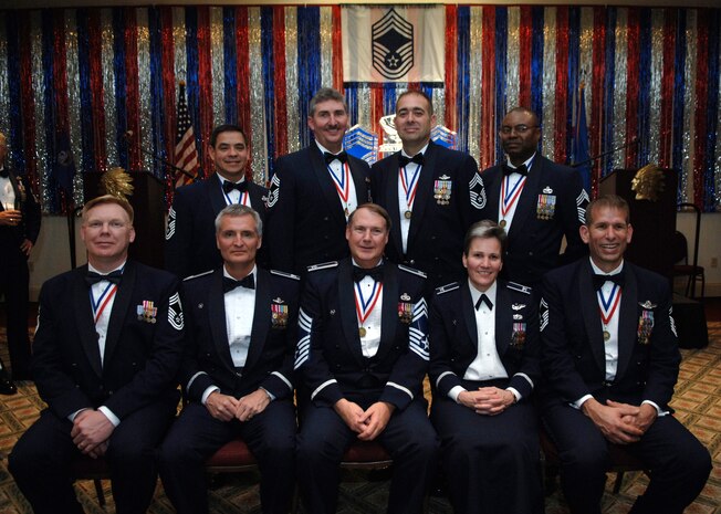 Members of Joint Team Charleston come together to pose for a group photo at the Annual Charleston Chief's Recognition Ceremony held at the Charleston Club Feb. 6. The ceremony recognized six Airmen of whom were selected for promotion to the rank of chief master sergeant, joined by 628th Air Base Wing Commander Col. Martha Meeker, 315th Airlift Wing Commander Col. Steven Chapman and honorary chief retired Col. Norman Moore. The ceremony is held annually to honor the dedication and efforts of the highest enlisted from Joint Base Charleston. (U.S. Air Force Photo/Airman 1st Class Lauren Main)