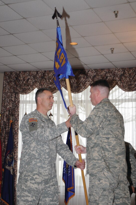 FORT EUSTIS, Va. -- Col. Glenn K. Grothe assumes command of the 733d Mission Support Group from Col. Donald E. Kirkland, 633d Air Base Wing commander, during an activation and assumption of command ceremony at the Fort Eustis Club Jan. 29. The 733 MSG activated under the 633 ABW in the first step toward realizing Joint Base Langley-Eustis in October. (U.S. Army photo/Lyna Tucker)