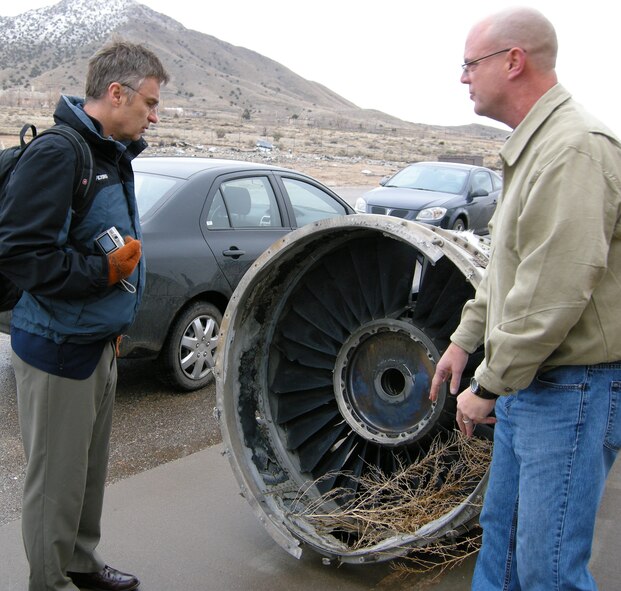 Robert Goyer, FLYING Magazine senior editor, was given a briefing and tour of the Air Force Crash Laboratory by Jeff Thomas, lead instructor.  U.S. Air Force photo by Marie Vanove