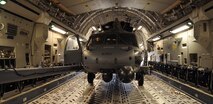 MOODY AIR FORCE BASE, Ga. -- An HH-60G Pave Hawk is loaded onto a C-17 Globemaster III here Feb. 4. The helicopter, along with four Moody Airmen and 40 Airmen from Nellis Air Force Base, Nev., are being transported to Haiti as part of a humanitarian relief mission. (U.S. Air Force photo by Airman 1st Class Benjamin Wiseman)