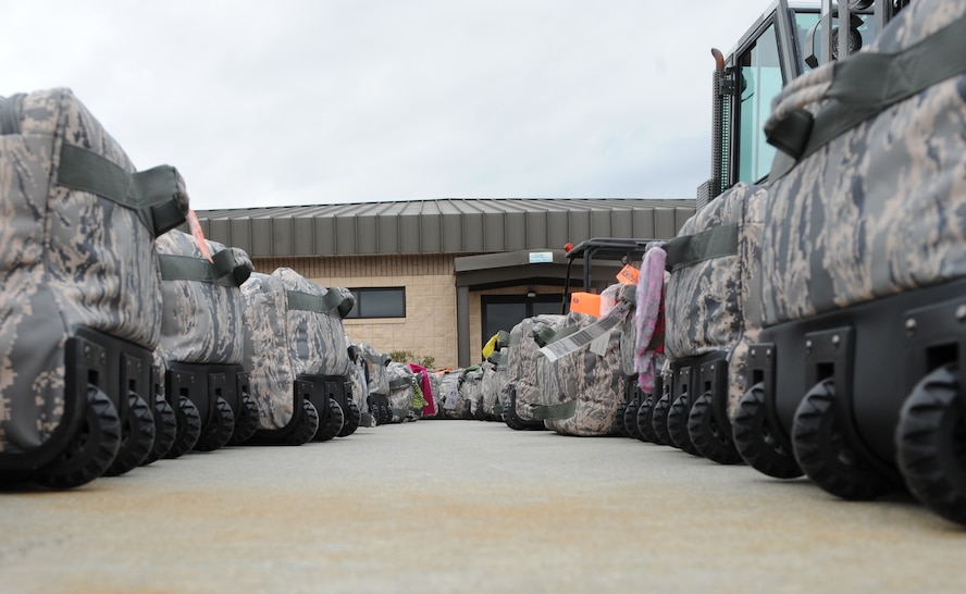 MOODY AIR FORCE BASE, Ga. -- Luggage is placed side-by-side before being loaded onto a C-17 Globemaster III here Feb. 4. Four Moody Airmen along with 40 Airmen from Nellis Air Force Base, Nev., will depart to Afghanistan as part of a humanitarian relief mission. (U.S. Air Force photo by Airman 1st Class Benjamin Wiseman)