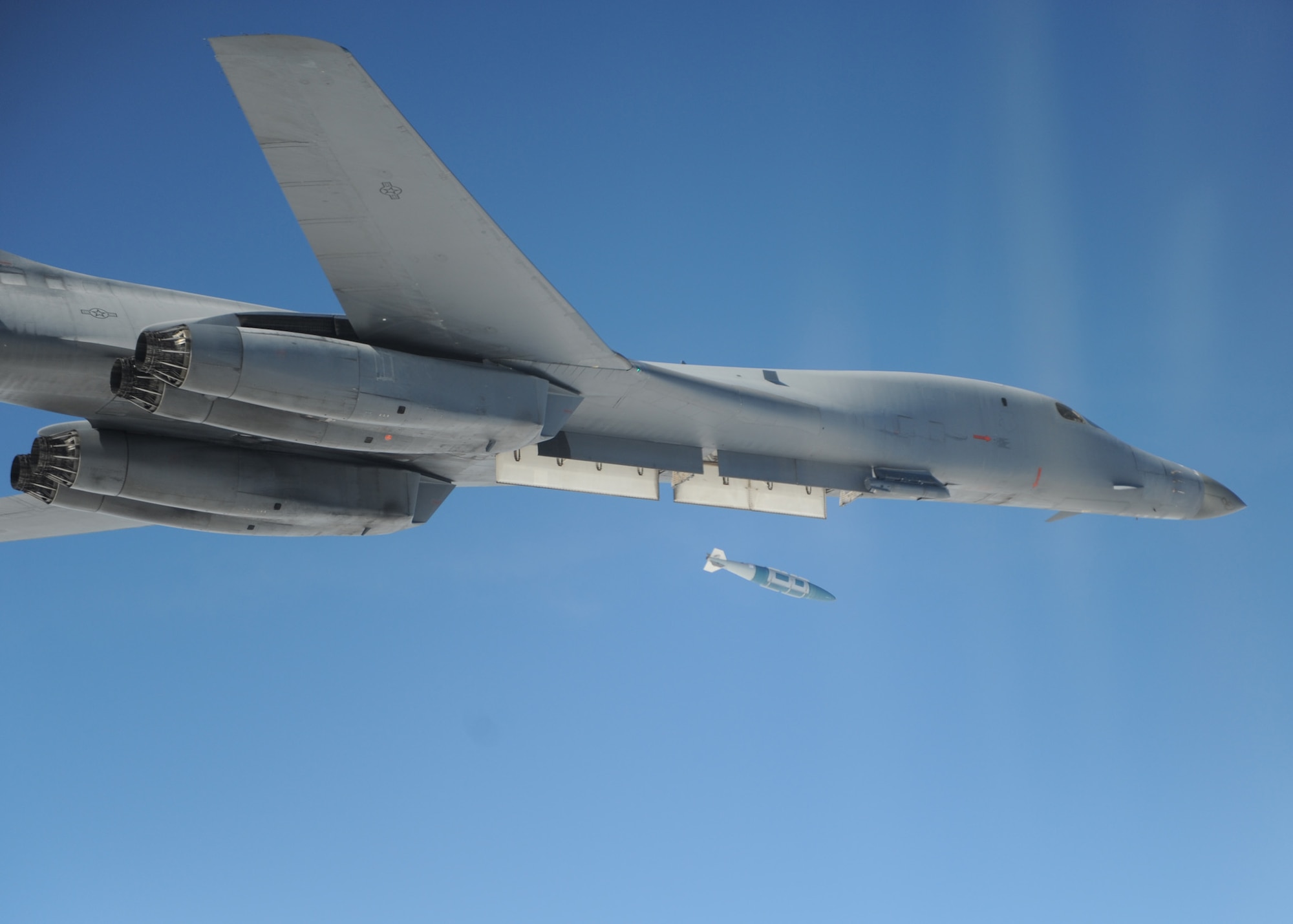 A B-1B Lancer from 7th Bomb Wing at Dyess AFB, Texas drops a Guided Bomb Unit-31 over the Eglin Air Force Base, Fla., range during a Combat Hammer mission Feb. 1.  Combat Hammer is an Air-to-Ground Weapons System Evaluation Program controlled by the 86th Fighter Weapons Squadron.  F-15Es from Seymour Johnson AFB, N.C., participated in the week-long evaluation dropping GPS and laser-guided weapons.  The WSEP was the first evaluation of Small Diameter Bombs at Eglin and first evaluation of Laser Joint Direct Attack Munitions in a Combat Hammer.  The WSEP program, run by the 53d Weapons Evaluation Group, is used to evaluate the effectiveness and suitability of combat air force weapon systems. The evaluations are accomplished during tactical deliveries of fighter, bomber and unmanned aerial system precision guided munitions, on realistic targets with air-to-air and surface-to-air defenses. For many of the aircrew participating in WSEP, it is the first time employing live weapons. This provides a level of combat experience many units face during combat.  (U.S. Air Force photo/Lt. Col. William Singletary.)