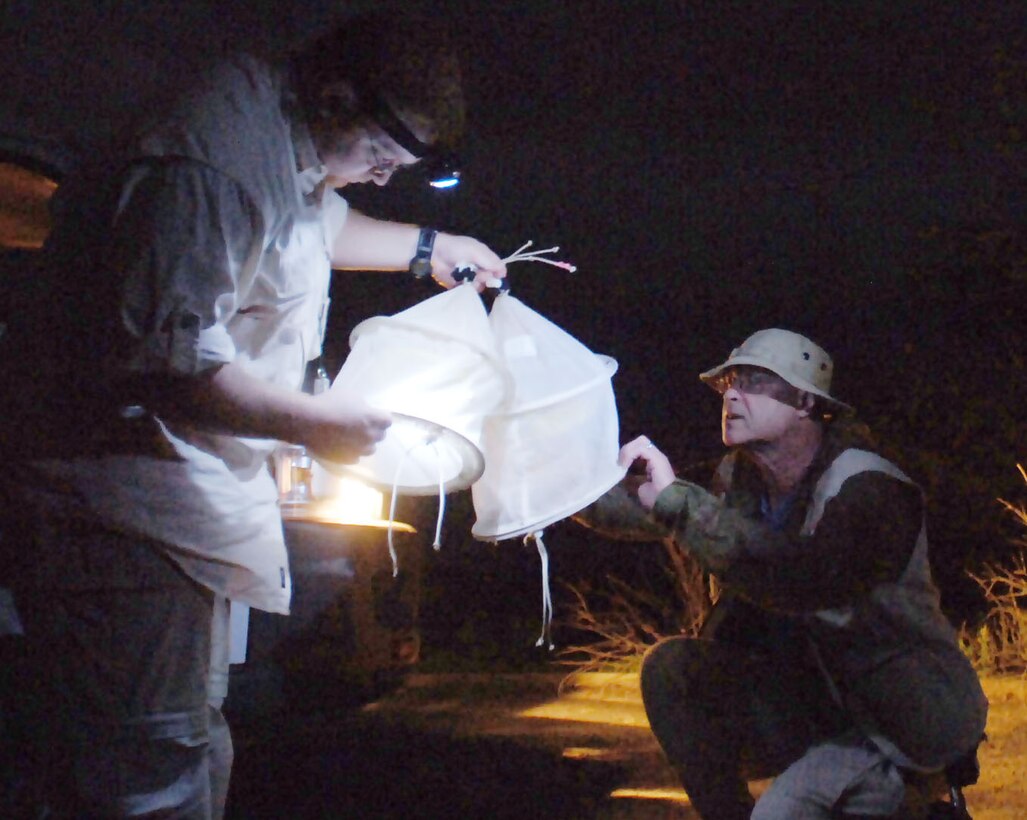 1st Lt. Earl Thomas (left) and Col. (Dr.) James Swaby examine traps during the vector-borne and infectious eisease field diagnostic development initiative Jan. 9, 2010, in Marigat, Kenya. The team assembled and hung traps to catch sand flies, which carry leishmaniasis. Lieutenant Thomas is an entomologist from Brooks City-Base, Texas, and Doctor Swaby is the 59th Medical Wing Clinical Research Division chief from Lackland Air Force Base, Texas. (U.S. Air Force photo/Senior Airman Josie Kemp)