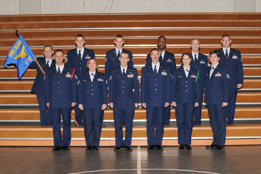 McGHEE TYSON AIR NATIONAL GUARD BASE, Tenn. -- NCO Academy Class 10-3, J-Flight, gathers at The I.G. Brown Air National Guard Training and Education Center here, Jan. 25, 2010.  Pictured (L-R front row) are Tech. Sgt. Fernando A. Lopez, Jr.; Tech. Sgt. Christina M. Hernandez; Tech. Sgt. James Dupuis; Tech. Sgt. William J. East; Tech. Sgt. Elizabeth M. Sailer; Tech. Sgt. Danielle Holloway, NCOA instructor; (L-R back row) Tech. Sgt. Jason J. Weir; Tech. Sgt. Kurtis W. Simmers; Tech. Sgt. Clifford R. Johnson; Tech. Sgt. Jerry W. Byrdo; Tech. Sgt. Glenn S. Walters; and Tech. Sgt. Aaron D. Wells. (U.S. Air Force photo by Master Sgt. Kurt Skoglund/Released)