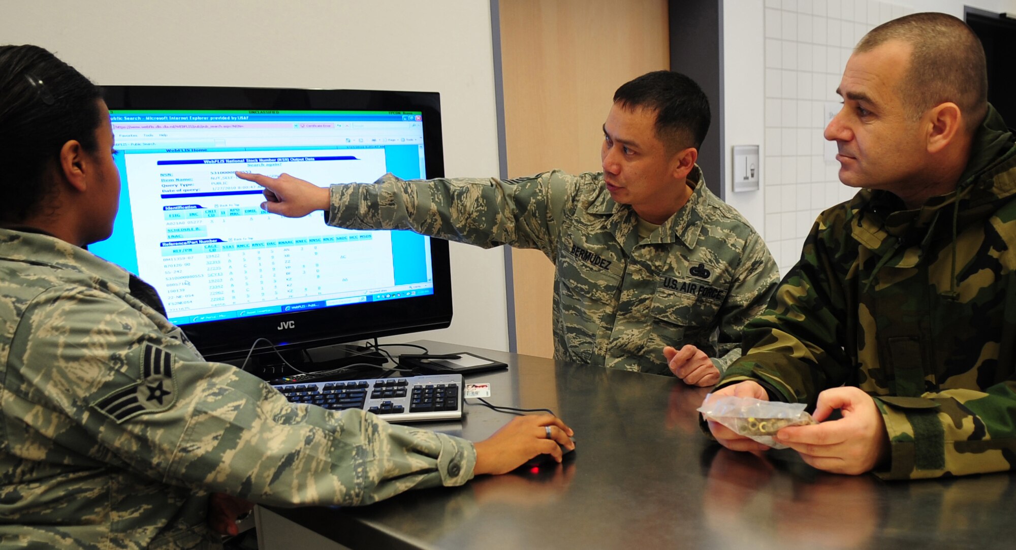 Master Sgt. Arthur Bermudez shows Republic of Macedonia army Maj. Ljupce Gorgievski the aircraft parts tracking system Jan. 27, 2010, at Ramstein Air Base, Germany. Sergeant Bermudez is a 86th Maintenance Squadron section chief with the aircraft parts store.(U.S. Air Force photo/Staff Sgt. Jocelyn Rich)