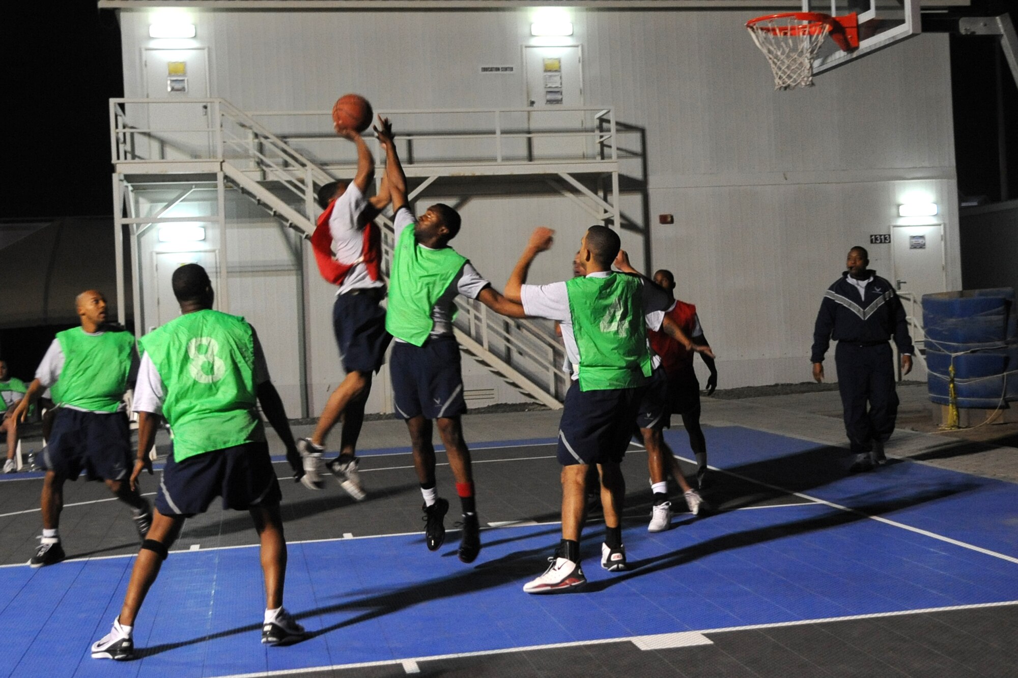 A member of 380th Expeditionary Security Forces Squadron attempts to make a shot during the wing intramural basketball championshiop game against the 380th Expeditionary Civil Engineer Squadron at non-disclosed location in Southwest Asia on Feb. 5, 2010. ECES won the game 29 -24.(U.S. Air Force Photo/Senior Airman Jenifer H. Calhoun/Released)
