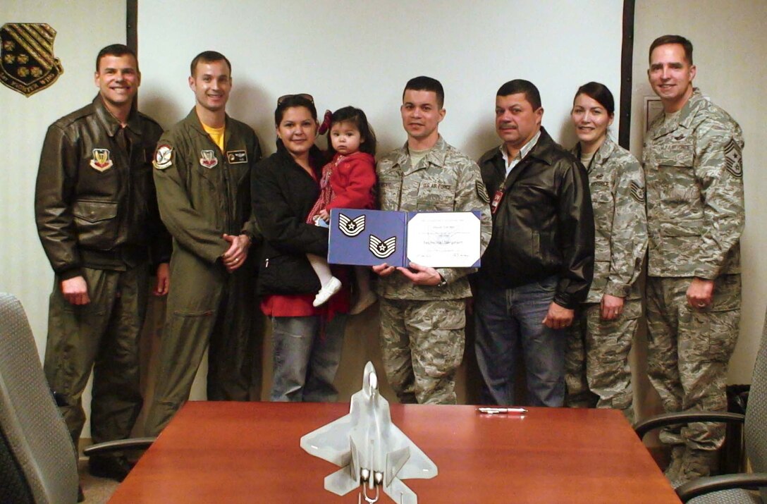 LANGLEY AIR FORCE BASE, Va. -- Col. Matt Molloy, 1st Fighter Wing commander, STEP promoted Staff Sgt. Oscar Cardec, 1 FW Advanced Programs Office, to technical sergeant Jan. 29. (U.S. Air Force photo/Staff Sgt. Lisette Spencer)