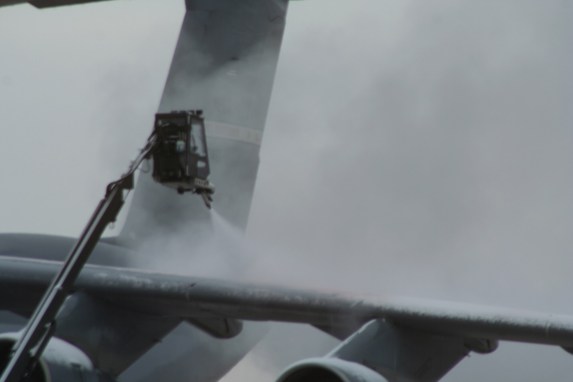 WRIGHT-PATTERSON AIR FORCE BASE, Ohio – Reservists from the 445th Aircraft Maintenance Squadron de-ice a C-5 Galaxy during the Feb. 7 unit training assembly after several inches of snow fell in the Dayton, Ohio area.  (U.S. Air Force photo/Tech. Sgt. Jeremy Caskey)