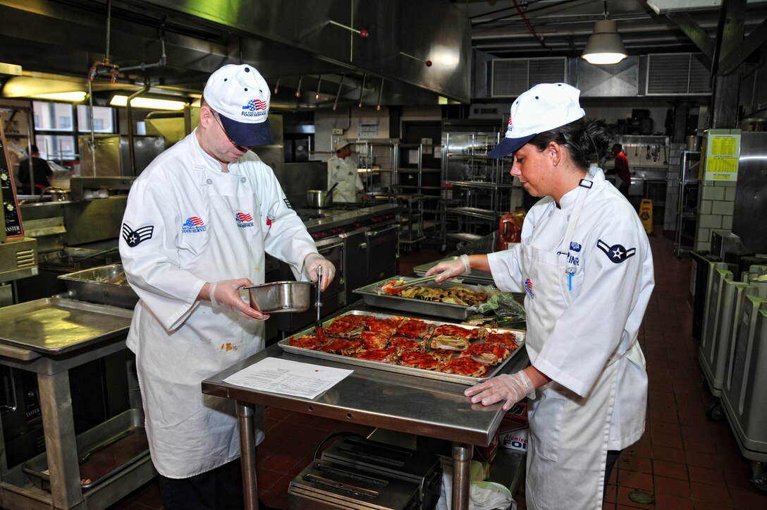 U.S Air Force Airmen Dale Stevens and Lindsey Steiner, 914th Service Squadron, prepare the days lunch, February, 6, 2010, Niagara Falls Air Reserve Station, NY. (U.S Air Force photo by Staff Sgt. Joseph Mckee)