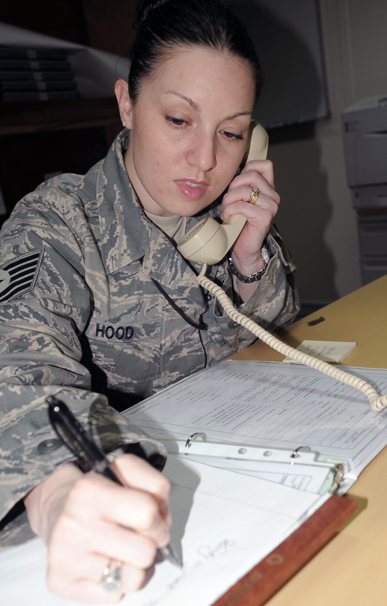 Tech. Sgt. Wendy Hood, command post craftsman deployed with the 380th Air Expeditionary Wing Command Post, works in her office during operations at a non-disclosed base in Southwest Asia on Feb. 3, 2010. Sergeant Hood is on her sixth deployment, but her first as a command post Airman.  She deployed previously as a civil engineering structures craftsman.  Sergeant Hood is deployed from the 75th Air Base Wing Command Post at Hill Air Force Base, Utah, and her hometown is Hooksett, N.H.  (U.S. Air Force Photo/Master Sgt. Scott T. Sturkol/Released)