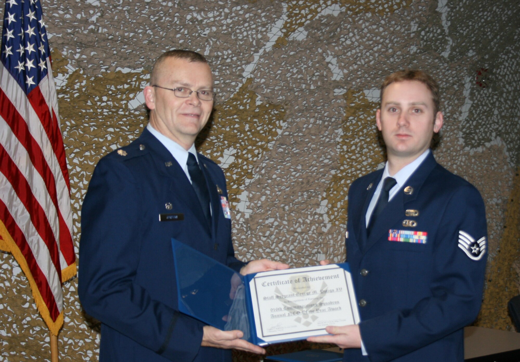 Lt. Col. James T. Horton, (left) commander of the 916th Communication Squadron, presents Staff Sgt. George M. Potzgo IV with the 916th Communication Squadron NCO of the Year award. (Photo by MSgt. Shane Lynch, 916/CS)