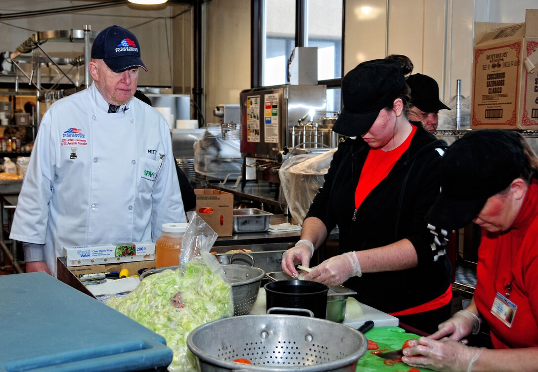 Art Ritt observing members of the 914th Services Squadron, preparing the days lunch, February 6, 2010, Niagara Falls Air Reserve Station, NY. Mr. Ritt is one of the judges determining which base will win the John L. Hennessy Award. (U.S Air Force Photo by Staff Sgt. Joseph McKee)