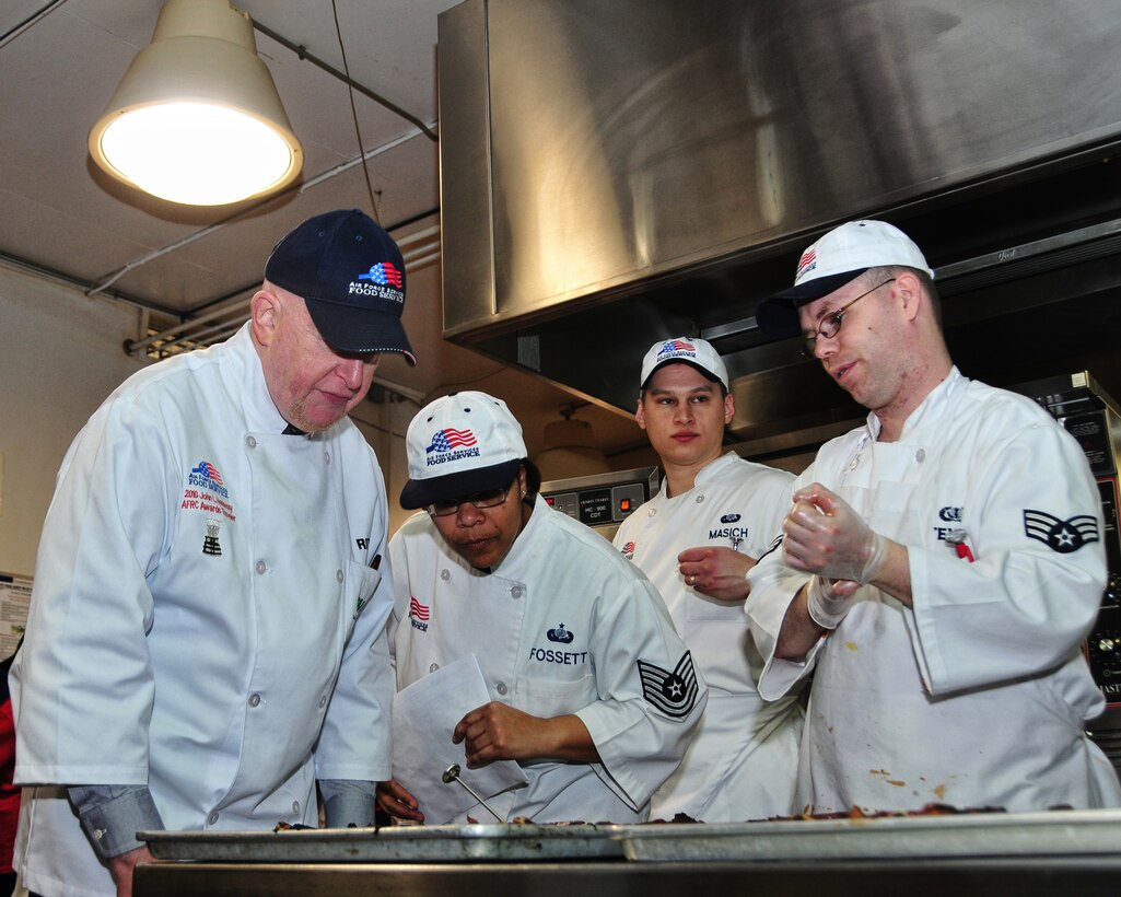 Art Ritt observing members of the 914th Services Squadron, preparing the days lunch, February 6, 2010, Niagara Falls Air Reserve Station, NY. Mr. Ritt is one of the judges determining which base will win the John L. Hennessy Award. (U.S Air Force Photo by Staff Sgt. Joseph McKee)