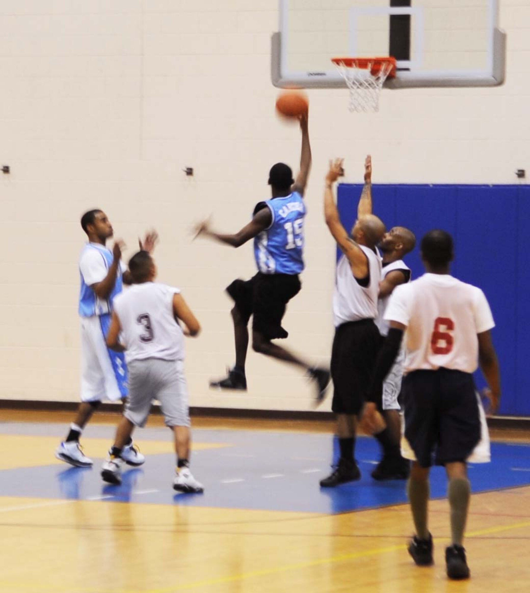 Brandon Doss, Combat Targeting and Intelligence Group, snags a rebound in an intramural basketball game against the 497th Intelligence, Surveillance and Reconnaissance Group, at the Shellbank Fitness Center Feb. 4. CTIG won the game 46-22. (U.S. Air Force photo/Airman 1st Class Jason J. Brown)