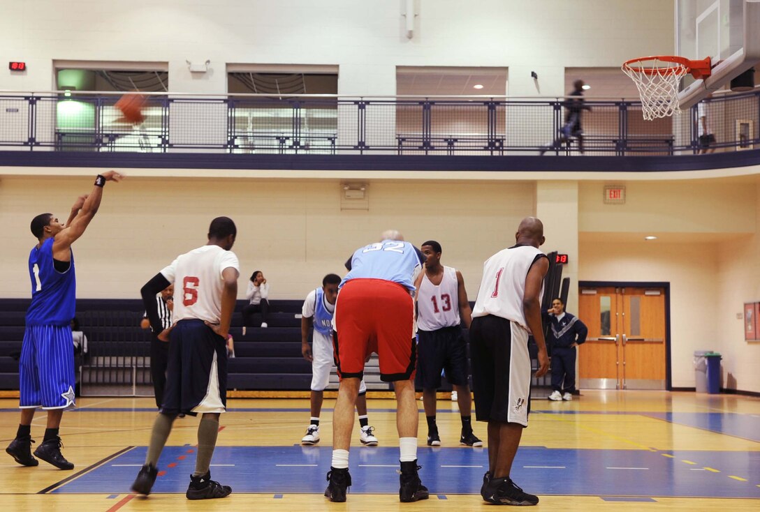 Drew Colen, Combat Targeting and Intelligence Group, attempts a free throw in an intramural basketball game against the 497th Intelligence, Surveillance and Reconnaissance Group at the Shellbank Fitness Center Feb. 4. CTIG won the game 46-22. (U.S. Air Force photo/Airman 1st Class Jason J. Brown)