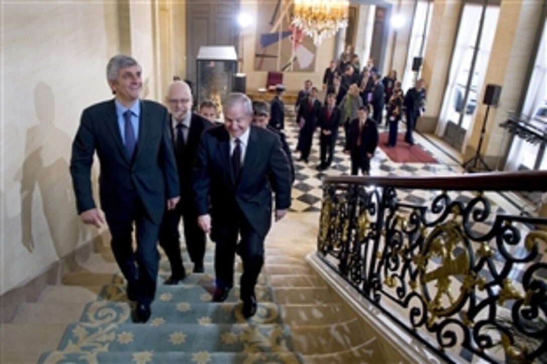 U.S. Defense Secretary Robert M. Gates walks with French Defense Minister Herve Morin to a meeting in Paris, Feb. 8, 2010.