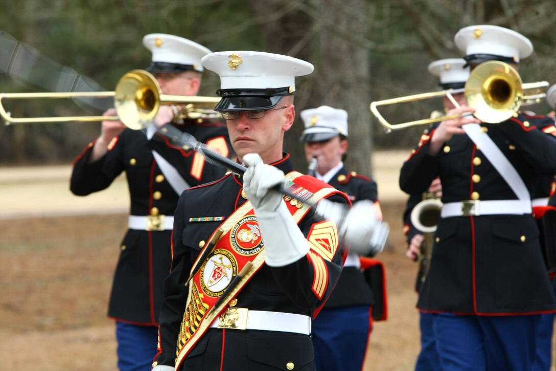 Gunnery Sgt. David Wilson, drum major with 2nd Marine Division Band, leads his ‘tune troopers’ in a band march on Feb. 9 during a personal demonstration for retired 1st Lt. Tony Mosely and retired Gunnery Sgt. James Richardson, the first African American band officer and drum major.