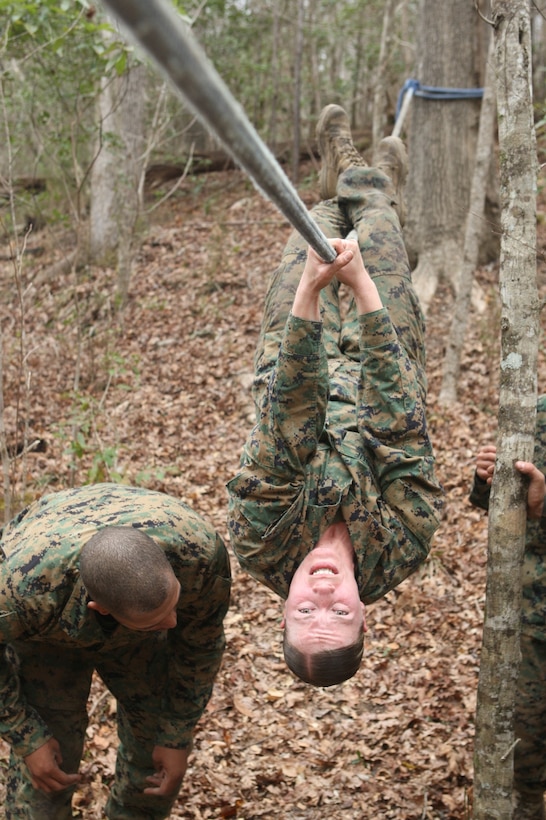 MARINE CORPS BASE CAMP LEJEUNE, N.C. – A corporal with Headquarters and Support Battalion, Marine Corps Base Camp Lejeune maneuvers across a rope obstacle during the Corporals Stamina Course aboard Stone Bay, Feb. 9. (Marine Corps photo by Lance Cpl. Jonathan G. Wright)