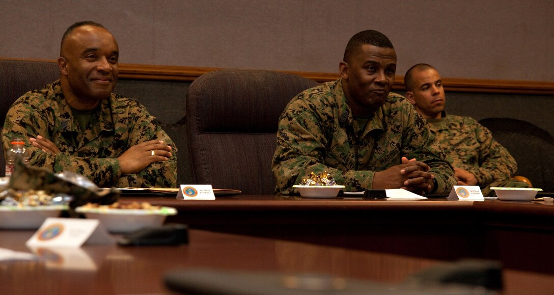 (From left to right) Sgts Maj. James R. Futrell and Randall Carter, U.S. Marine Corps Forces, Pacific, sergeant major and I Marine Expeditionary Force sergeant major (respectively), attend the 2010 MarForPac Senior Enlisted Symposium Feb. 9 on Camp H.M. Smith, Hawaii. The purpose of the symposium was to bring MarForPac's top enlisted together, discuss current operations, and address issues Marines face in combat and at home. (U.S. Marine Corps Photo by Sgt. Juan D. Alfonso) (Released)