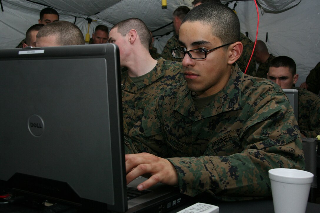 Cpl. Benjamin Alvarez manages a list of active and upcoming missions during a Marine air command and control systems integrated site training exercise at Davis Airfield, south of Jacksonville, N.C., Feb. 9. Alvarez is an air support operator with Cherry Point’s Marine Air Support Squadron 1