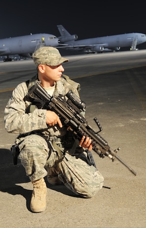 U.S. Air Force Airman 1st Class Frankie Piland watches over the flightline at an air base in the Middle East Jan. 31, 2010. Security forces Airmen are in charge of protecting and providing security for thousands of deployed service members and millions of dollars worth of deployed military assets and equipment. Airman Piland is deployed from the 628th Security Forces Squadron and is assigned to the 380th Expeditionary Security Forces Squadron. (U.S. Air Force photo by Master Sgt. Scott T. Sturkol/Released)