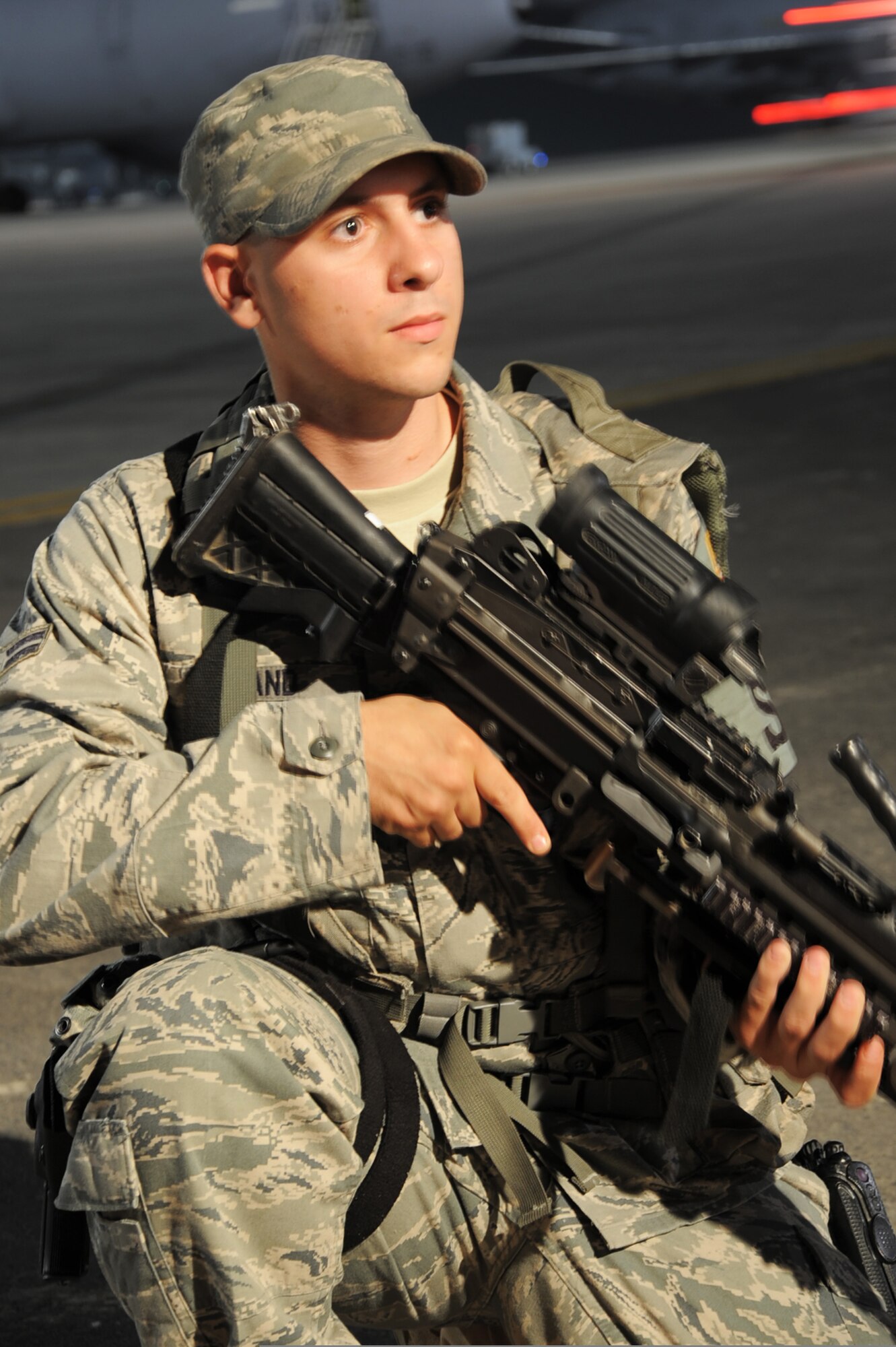 U.S. Air Force Airman 1st Class Frankie Piland watches over the flightline at an air base in the Middle East Jan. 31, 2010. Security forces Airmen are in charge of protecting and providing security for thousands of deployed service members and millions of dollars worth of deployed military assets and equipment. Airman Piland is deployed from the 628th Security Forces Squadron and is assigned to the 380th Expeditionary Security Forces Squadron. (U.S. Air Force photo by Master Sgt. Scott T. Sturkol/Released)