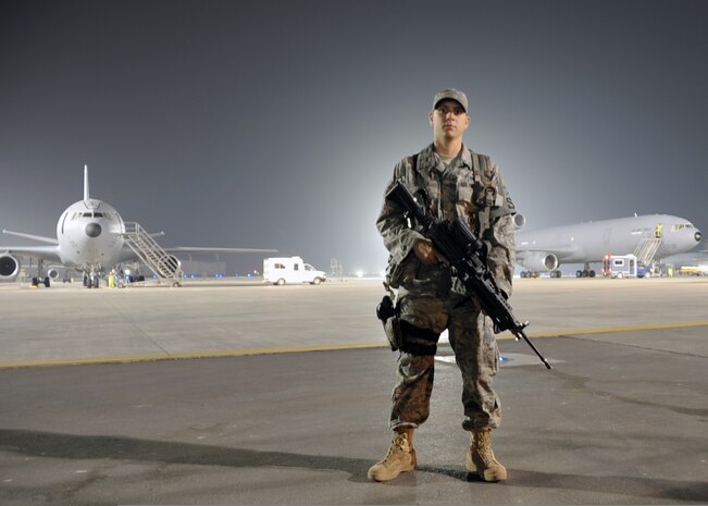 U.S. Air Force Airman 1st Class Frankie Piland watches over the flightline at an air base in the Middle East Jan. 31, 2010. Security forces Airmen are in charge of protecting and providing security for thousands of deployed service members and millions of dollars worth of deployed military assets and equipment. Airman Piland is deployed from the 628th Security Forces Squadron and is assigned to the 380th Expeditionary Security Forces Squadron. (U.S. Air Force photo by Master Sgt. Scott T. Sturkol/Released)