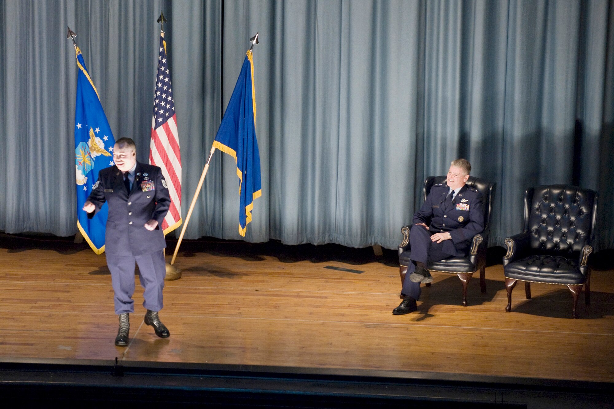 Tech. Sgt. Israel Del Toro speaks to the audience Feb. 8 at the nearly packed base theater at Randolph Air Force Base, Texas, after his re-enlistment in the Air Force.  Sergeant Del Toro, who suffered burns to more than 80 percent of his body after his vehicle was struck by an improvised explosive device in Afghanistan, will continue to serve as an instructor and recruiter for tactical air control party students. (U.S. Air Force photo/Steve Thurow)