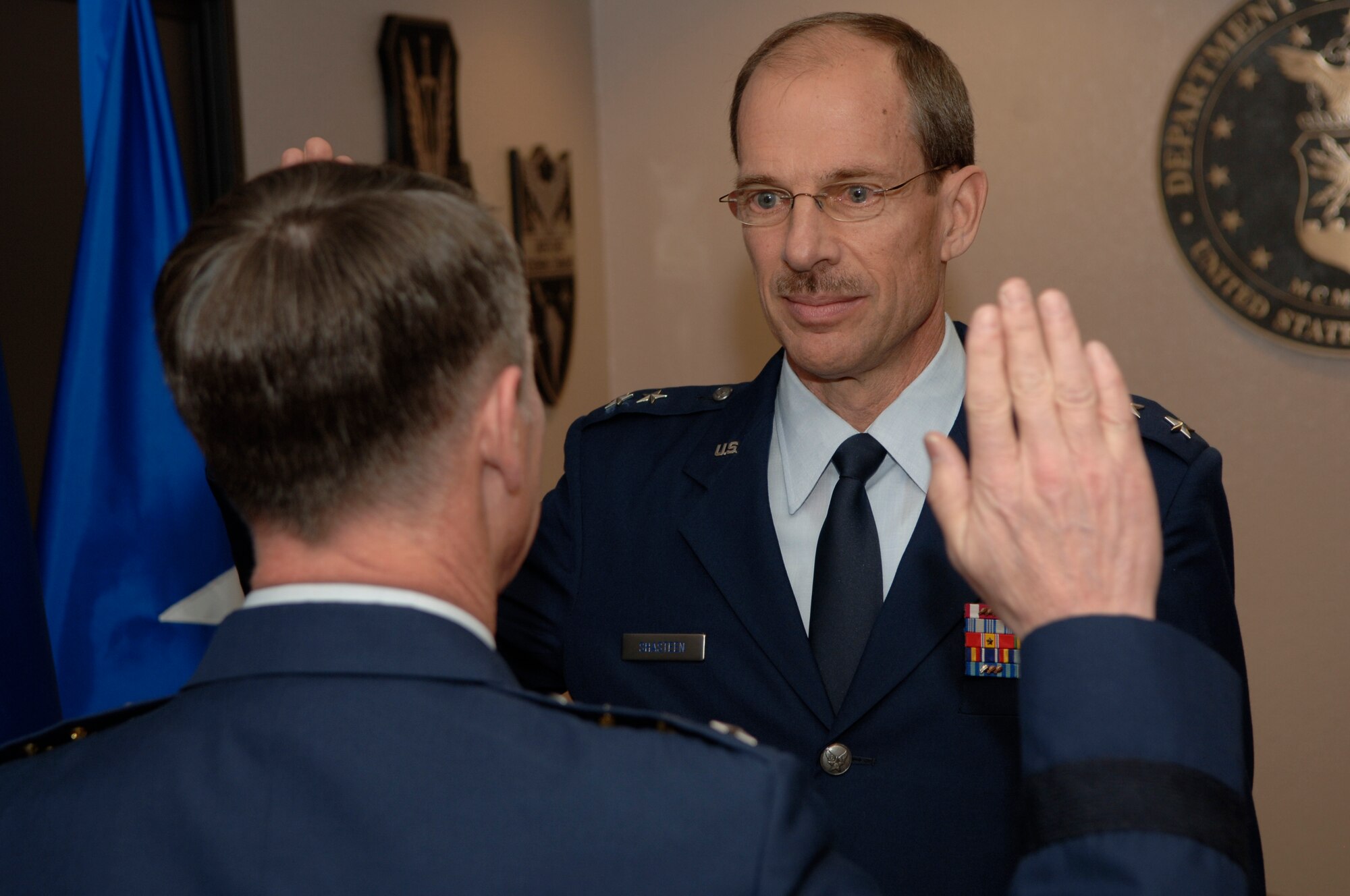 DAVIS-MONTHAN AIR FORCE BASE, Ariz. -- Lt. Gen. Glenn Spears (left), 12th Air Force (Air Forces Southern) commander, administers the oath of office to Maj. Gen. Jon Shasteen (right). General Shasteen is the mobilization assistant to the commander and was promoted to major general Feb. 5. (U.S. Air Force photo/Tech. Sgt. Eric Petosky)