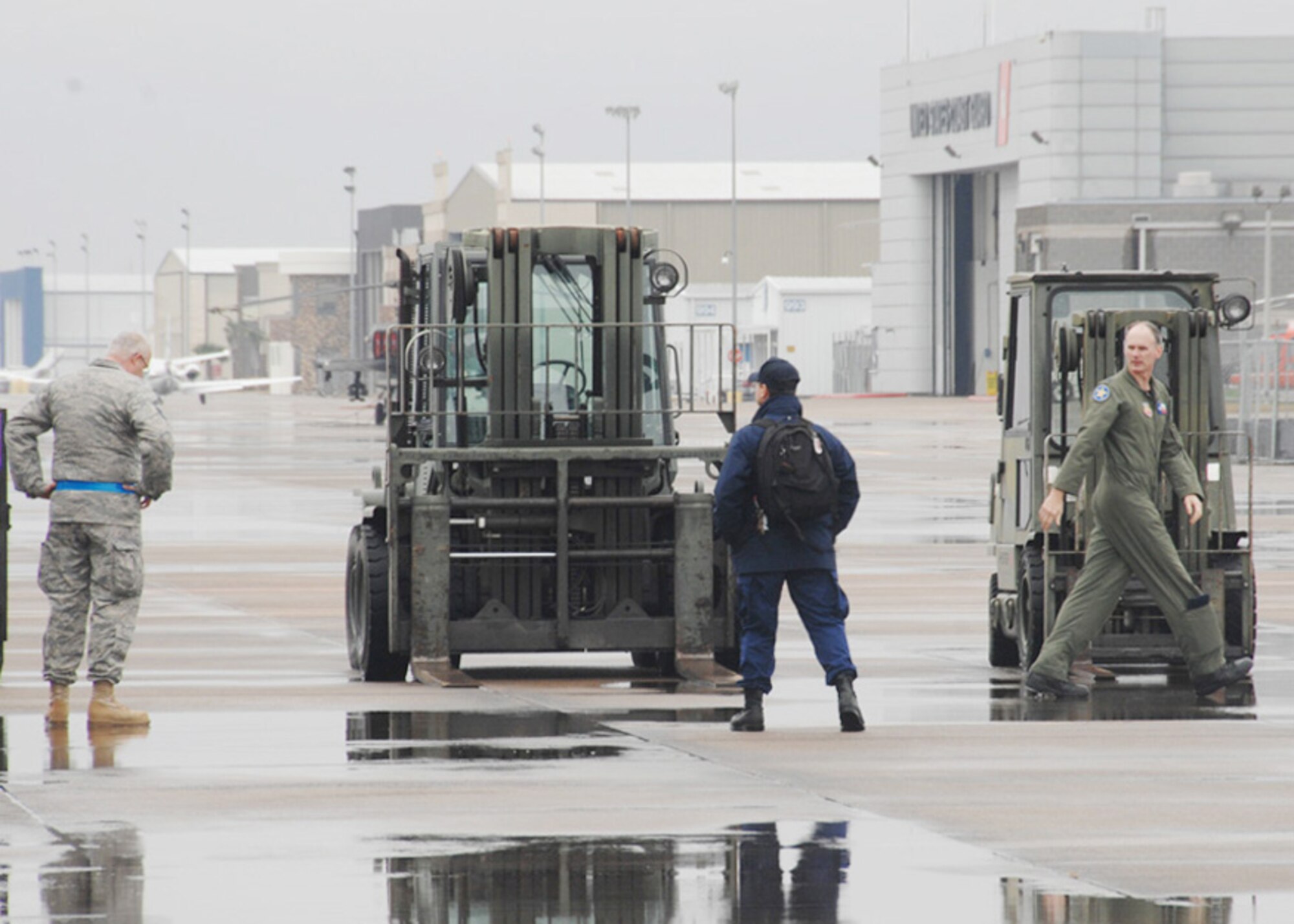 147th Reconnaissance Wing member wait to unlaod trucks carrying equipment for Texas Task Force One at Ellington Field Joint Reserve Base, Houston Texas, January 14, 2010.  147 RW photo by: Msgt Dale Hanson
