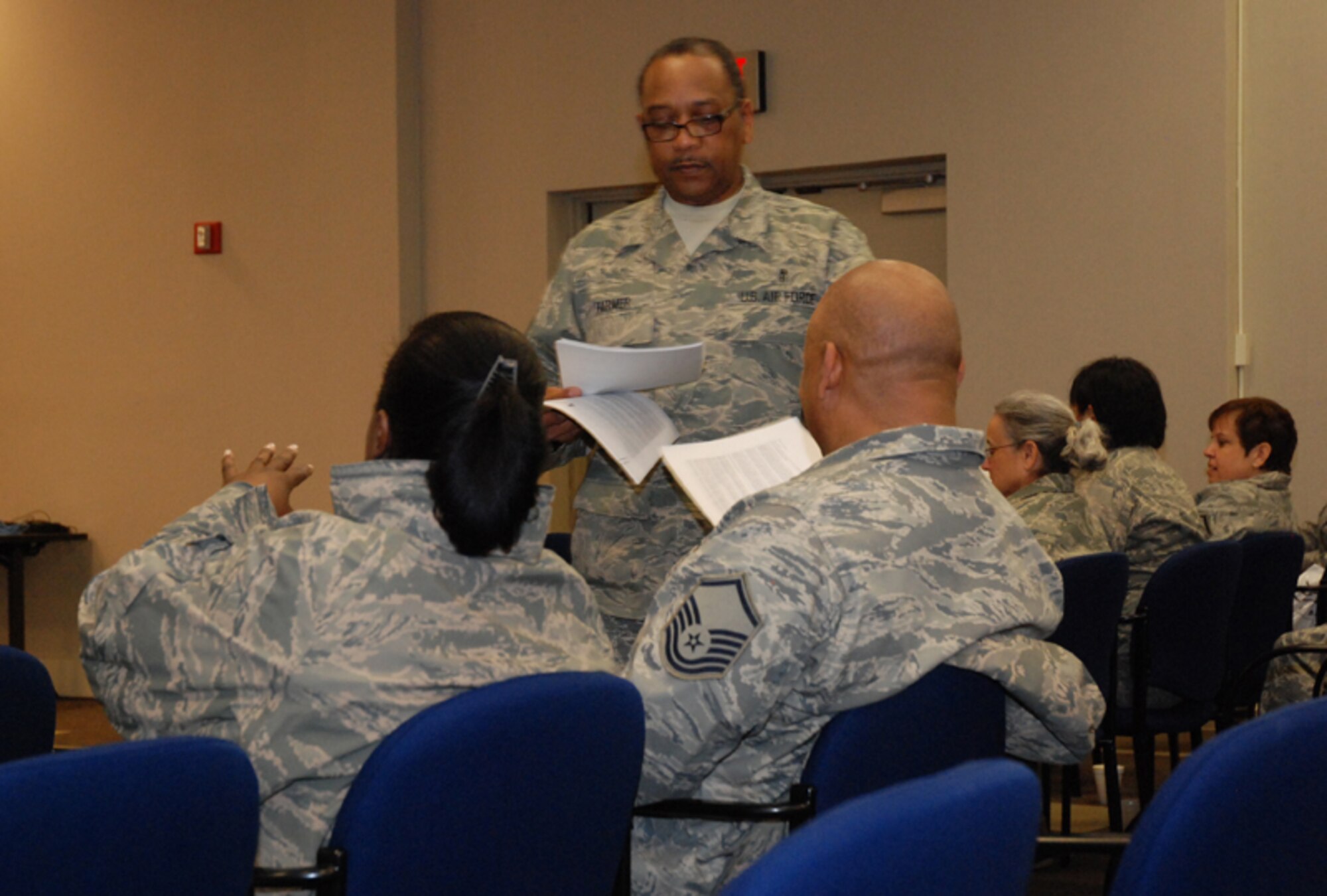 Master Sgt. Ernest H. Farmer, psychological health advocate, 94th Aeromedical Staging Squadron provides Airmen with health information at the Yellow Ribbon Reintegration Program at the 22nd Air Force Conference Center here Feb. 7. The goal of the program is to prepare them for mobilization, sustain them during mobilization, and reintegrate Airmen with their families, communities, and employers upon return. (U.S. Air Force photo/Senior Airman Shaun Shenk)