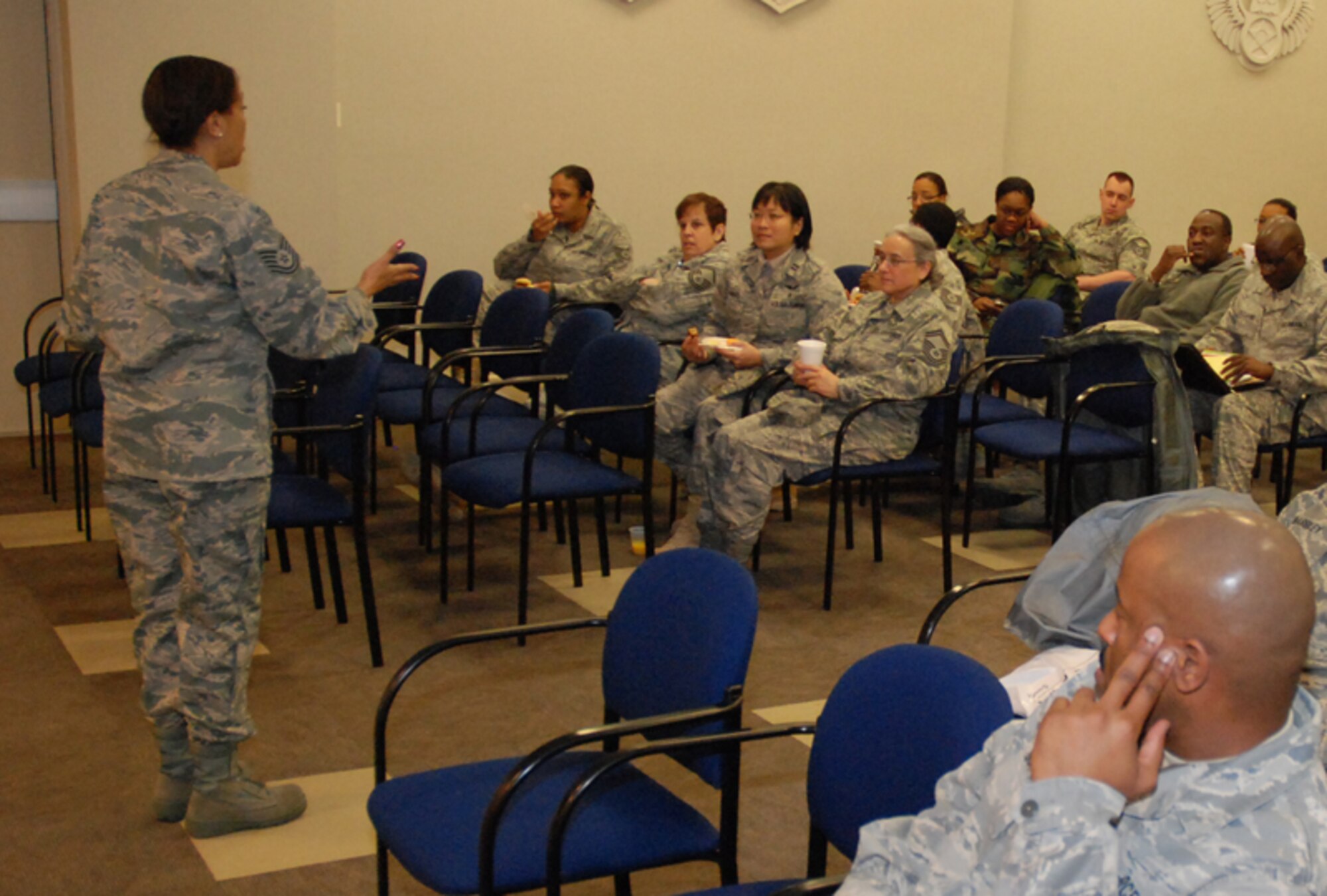 Tech. Sgt. Cynthia Owens of Airmen and Family Readiness gives attendees an overview of the planned activities for the Yellow Ribbon Reintegration Program at the 22nd Air Force Conference Center here Feb. 7. The goal of the program is to prepare them for mobilization, sustain them during mobilization, and reintegrate Airmen with their families, communities, and employers upon return. (U.S. Air Force photo/Senior Airman Shaun Shenk)