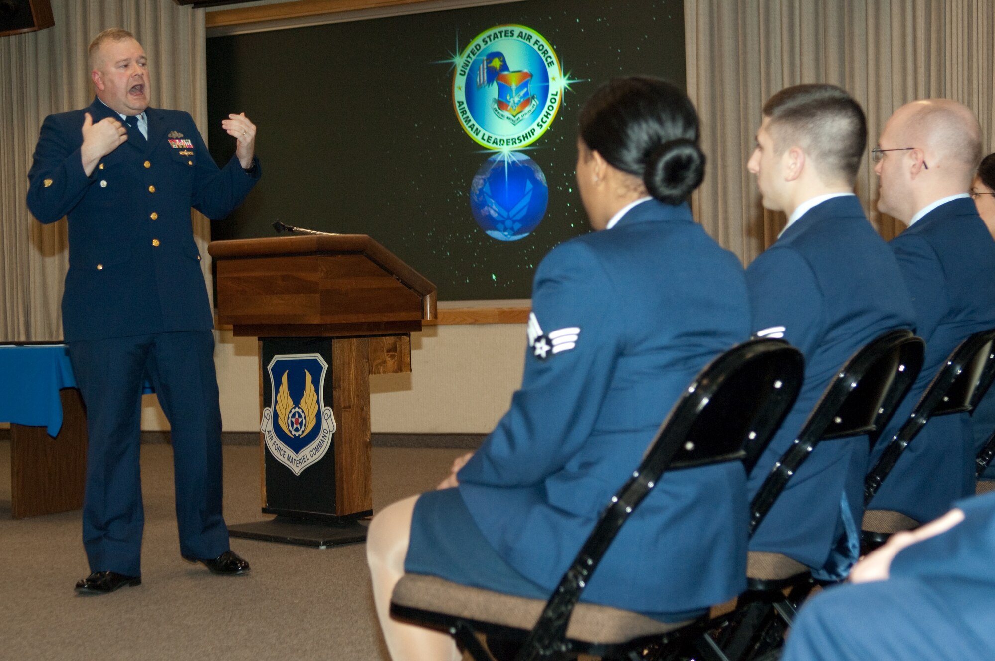 Master Chief Petty Officer Jerald Motyka, safety manager and training coordinator for Coast Guard Sector Boston, addresses the members of Airmen Leadership School Class 10B during the class graduation cermeonies Feb. 5 at the Hanscom Conference Center. Twelve enlisted members graduated from the course, which prepares them for their future roles as non-commissioned officers. (U.S. Air Force photo by Rick Berry)