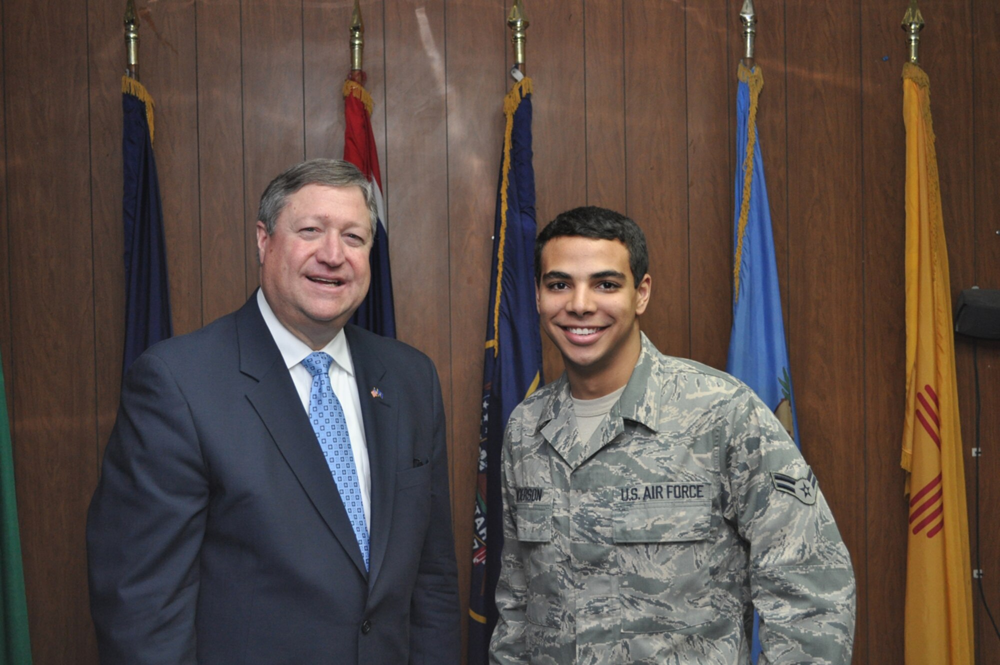 Airman 1st Class Cameron Anderson, 64th Expeditionary Support Squadron contingency contracting officer, meets Michael Donley, secretary of the Air Force, in Southwest Asia, Jan. 30.  The SECAF was conducting a base morale visit, and spoke to the base populace on current Air Force topics. Airman Anderson is assigned to the 17th Contracting Squadron, Goodfellow Air Force Base, Texas as a contract administrator.  (U.S. Air Force photo)
