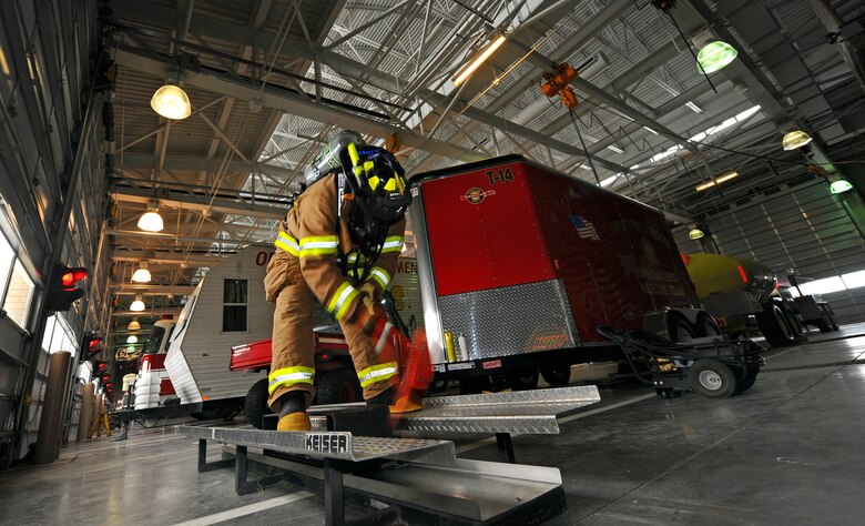 OFFUTT AIR FORCE BASE, Neb.- Tyler Carr, 55th Civil Engineering Squadron firefighter, going through a barrage of tests intended to get his breathing and heart rate up inside the fire stations garage Feb. 5.  The tests help evalute the new hawk mask to be utilized Air Force wide in the coming weeks. Daily equipment tests are part of a firefighter's job and helps ensure mission readiness. U.S. Air Force photo by Josh Plueger
