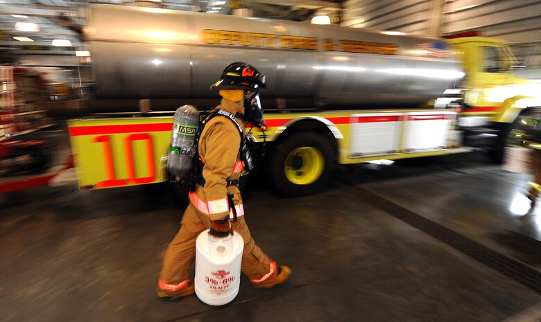 OFFUTT AIR FORCE BASE, Neb.- Tyler Carr, 55th Civil Engineering Squadron firefighter, goes through a barrage of tests intended to get his breathing and heart rate up inside the fire station's garage Feb. 5.  The tests evaluated the new fire hawk mask to be implemented Air Force wide in the coming weeks. Daily equipment tests are part of a firefighter's job and help ensure mission readiness. U.S. Air Force photo by Josh Plueger
