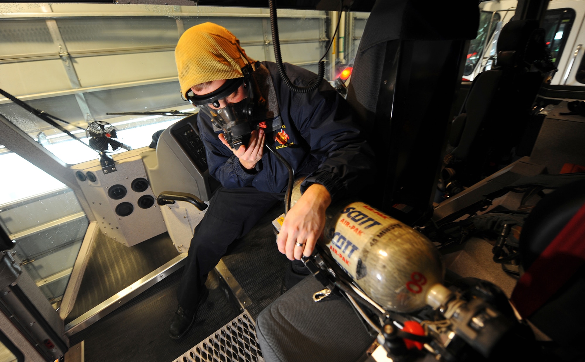 OFFUTT AIR FORCE BASE, Neb.- Derek Larson, a firefighter and driver engineer for the 55th Civil Engineering Squadron Fire Department, checks the Self Contained Breathing Apparatus, or SCBA, for operational readiness inside a fire truck as part of daily operational checks  Feb. 5. Firefighters with the fire department, perform a long list of equipment checks daily. U.S. Air Force photo by Josh Plueger

