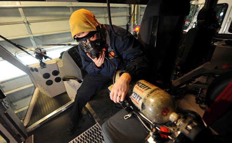 OFFUTT AIR FORCE BASE, Neb.- Derek Larson, a firefighter and driver engineer for the 55th Civil Engineering Squadron Fire Department, checks the Self Contained Breathing Apparatus, or SCBA, for operational readiness inside a fire truck as part of daily operational checks  Feb. 5. Firefighters with the fire department, perform a long list of equipment checks daily. U.S. Air Force photo by Josh Plueger

