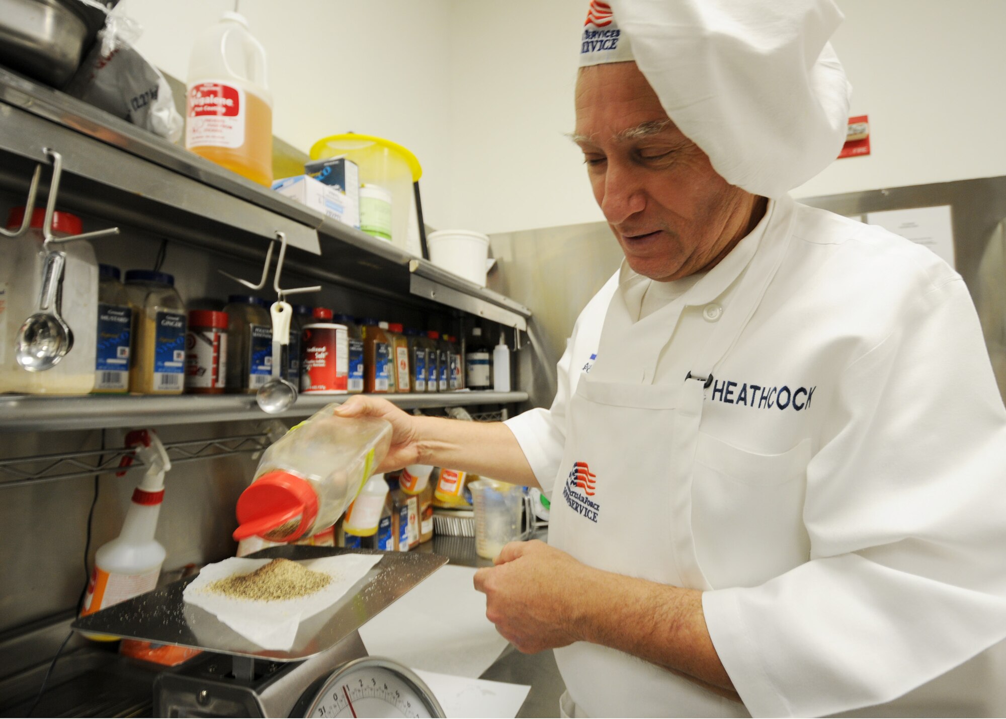 Samuel Heathcock, 96th Force Support Squadron, measures some spices prior to lunch at Eglin's "The Breeze" dining facility, Feb. 9.  The "Breeze" serves approximately 580 personnel at lunch and 1,500 throughout the day between breakfast and dinner.  (U.S. Air Force photo/Airman 1st Class Anthony Jennings.)