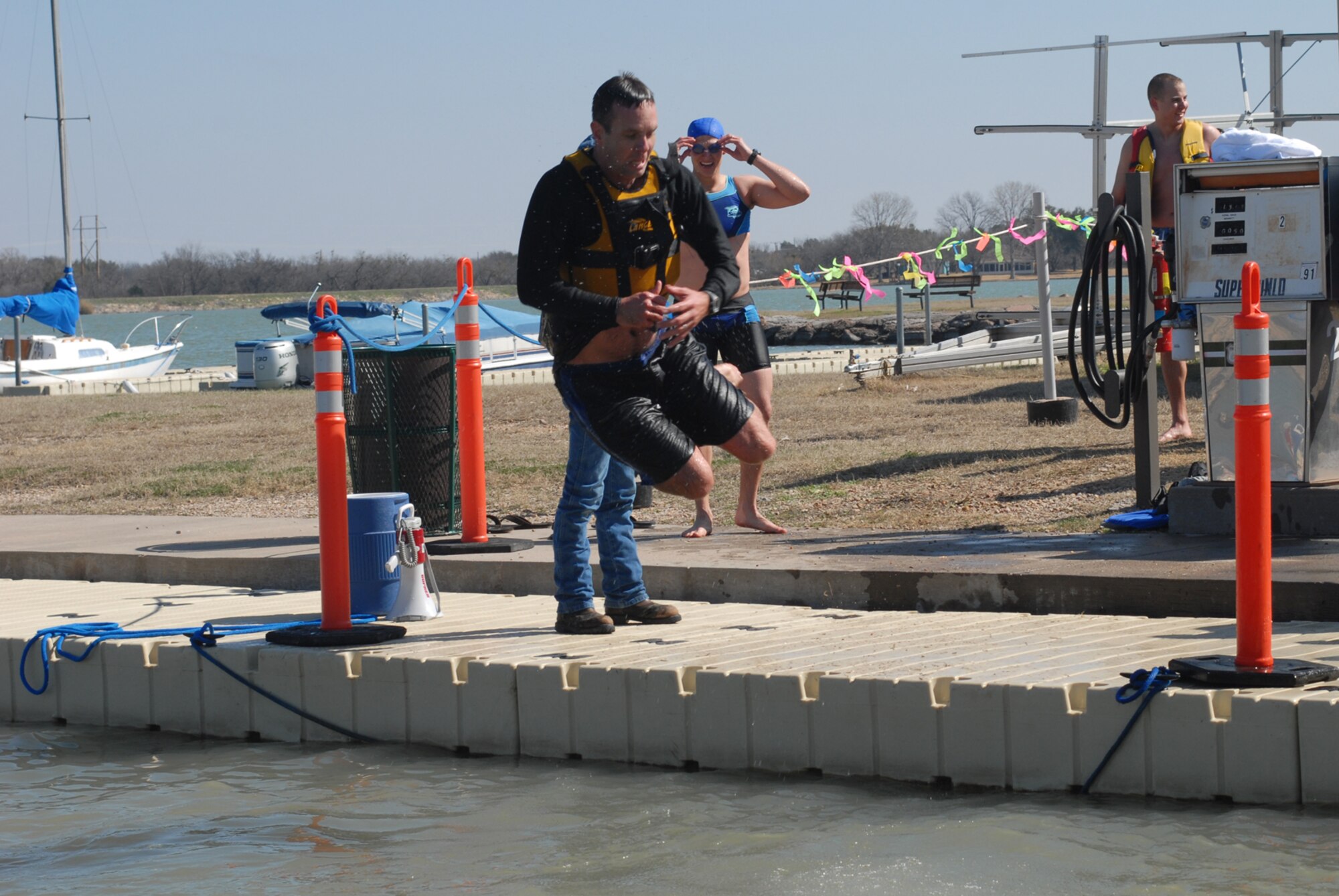 SAN ANGELO, Texas -- Lt. Col. Jeffrey McBride, 312th Training Squadron commander, jumps into Lake Nasworthy for the fifth time and final time of the day during the annual Polar Bear Swim at the Goodfellow Air Force Base Recreation Camp, Feb. 6, 2010. More than 180 Goodfellow AFB members participated in this event. Water temperature was 33 degrees. (U.S. Air Force photo/Staff Sgt. Laura R. McFarlane)
