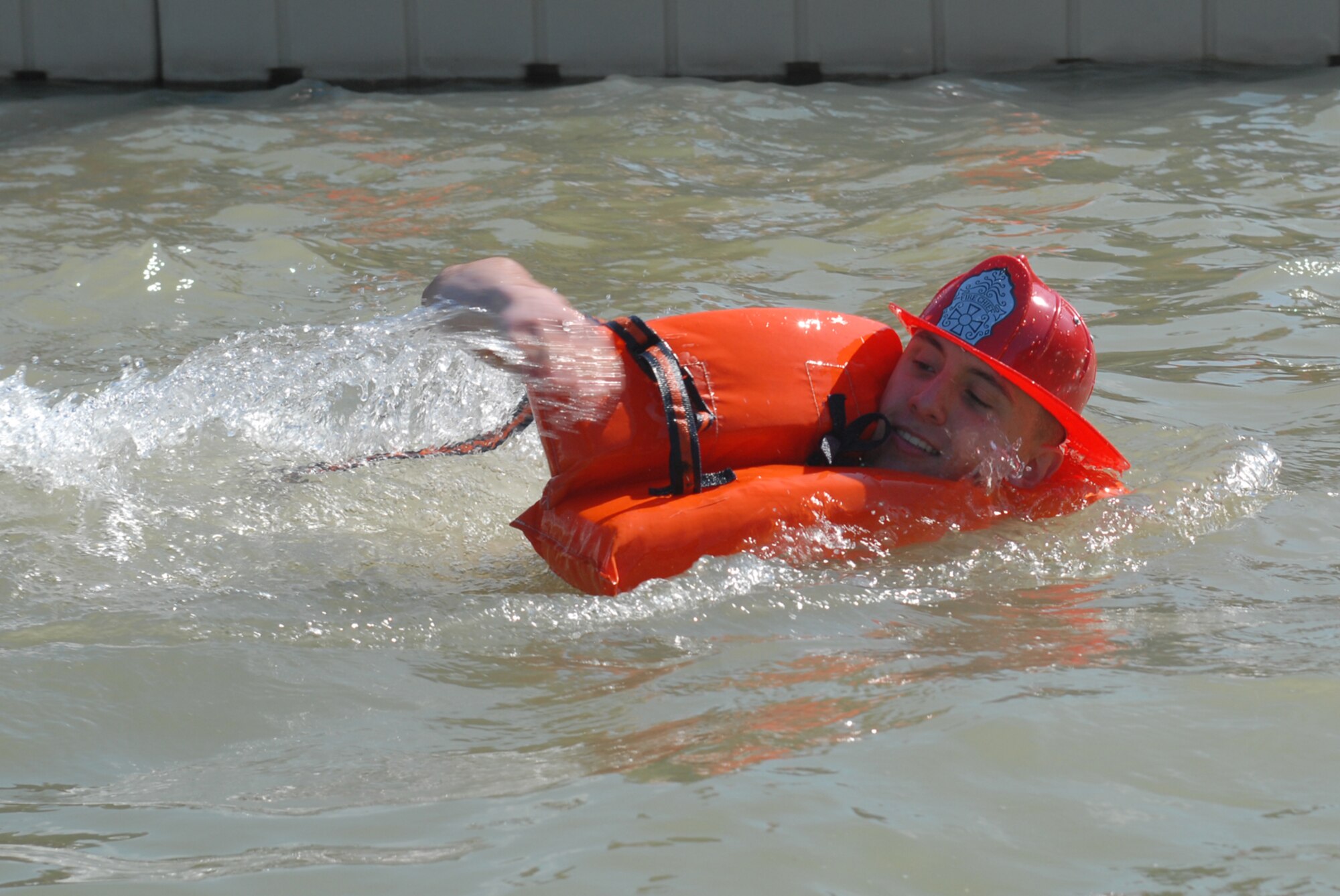 SAN ANGELO, Texas -- Airman Basic Zach Weldon, a student with the 312th Training Squadron, swims back to the dock during the annual Polar Bear Swim at the Goodfellow Air Force Base Recreation Camp, Feb. 6, 2010. More than 180 Goodfellow AFB members participated in this event. Water temperature was 33 degrees. (U.S. Air Force photo/Staff Sgt. Laura R. McFarlane)
