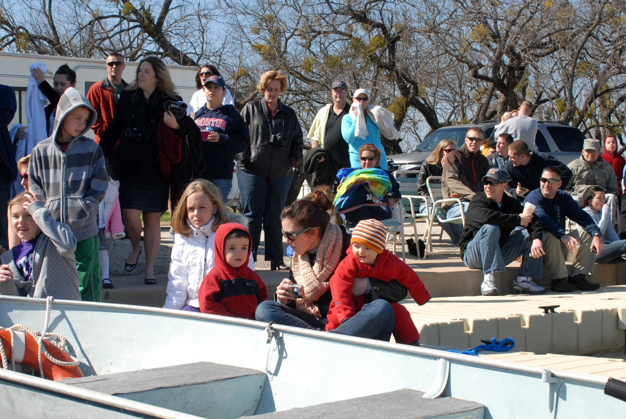SAN ANGELO, Texas -- The crowd watches as Goodfellow Air Force Base members jump into Lake Nasworthy during the annual Polar Bear Swim at the Goodfellow AFB Recreation Camp, Feb. 6, 2010. More than 180 Goodfellow AFB members participated in this event. Water temperature was 33 degrees. (U.S. Air Force photo/Staff Sgt. Laura R. McFarlane)
